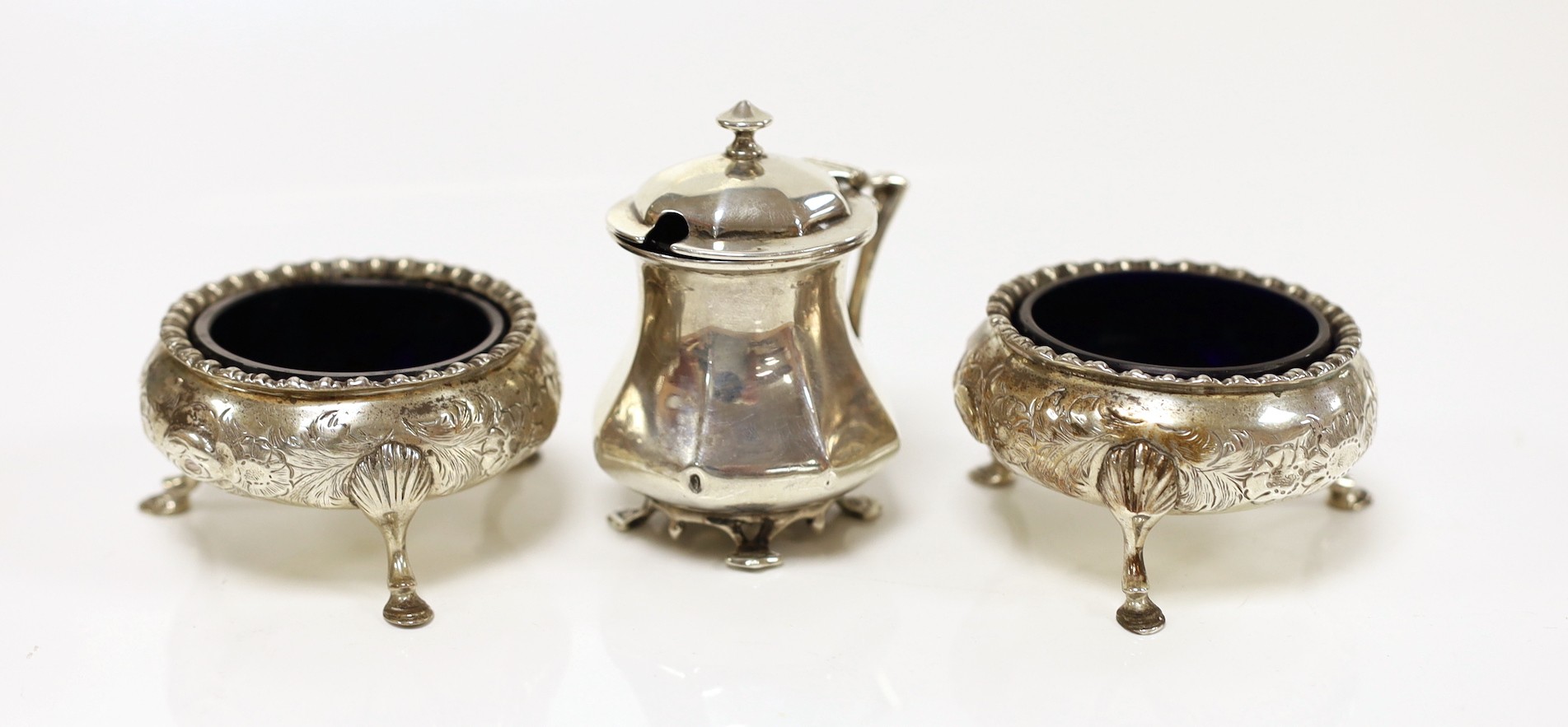 A pair of Victorian silver bun salts by Daniel & Charles Houle, London, 1851 and an Art Nouveau silver mustard pot, Goldsmiths & Silversmiths Co Ltd, London, 1909.